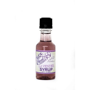 May include: A clear glass bottle with a purple liquid inside. The bottle has a black cap and a white label that says "Wayward Winds Lavender All Natural Lavender Syrup 1.69 FL OZ / 50 ML."