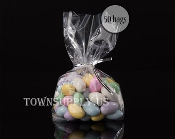 May include: A clear plastic bag with a twist tie closure filled with pastel-colored candy. The bag is labeled "50 bags".