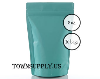 May include: A teal stand-up pouch with a resealable top. Two circular overlays on the right side display the text 8 oz. and 20 bags. The text TOWNSUPPLY.US is printed in black at the bottom center of the pouch, which has a smooth finish.