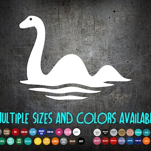 May include: A white vinyl decal featuring the silhouette of the Loch Ness monster emerging from water, with the text "MULTIPLE SIZES AND COLORS AVAILABLE" and a grid of various circular color swatches displayed below the graphic.
