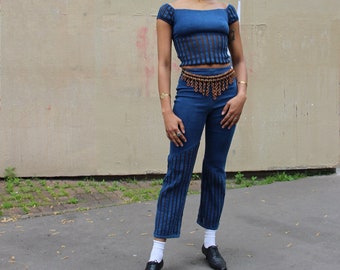 Trousers and top set in blue jeans and transparent black net