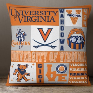 May include: Orange and white throw pillow with a patchwork design featuring the University of Virginia logo, the words "Wahoo Wa", and the text "University of Virginia".