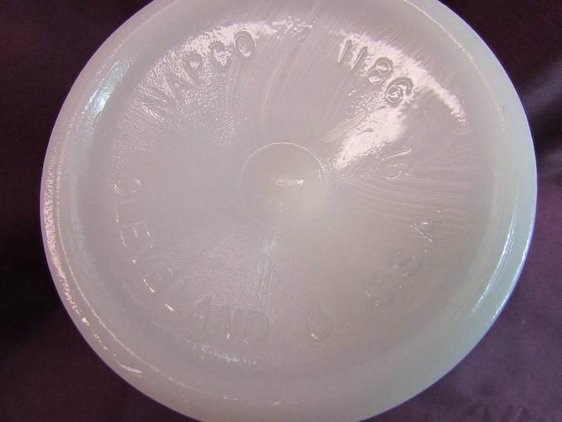 May include: White milk glass pitcher with a textured surface and the words "WACO 1966" embossed on the bottom.