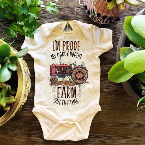 baby clothes with tractors on them