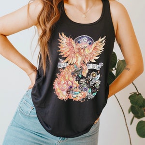 May include: Black tank top with a graphic print of a phoenix with flames and flowers. The text "Light my fire" is printed on the graphic.