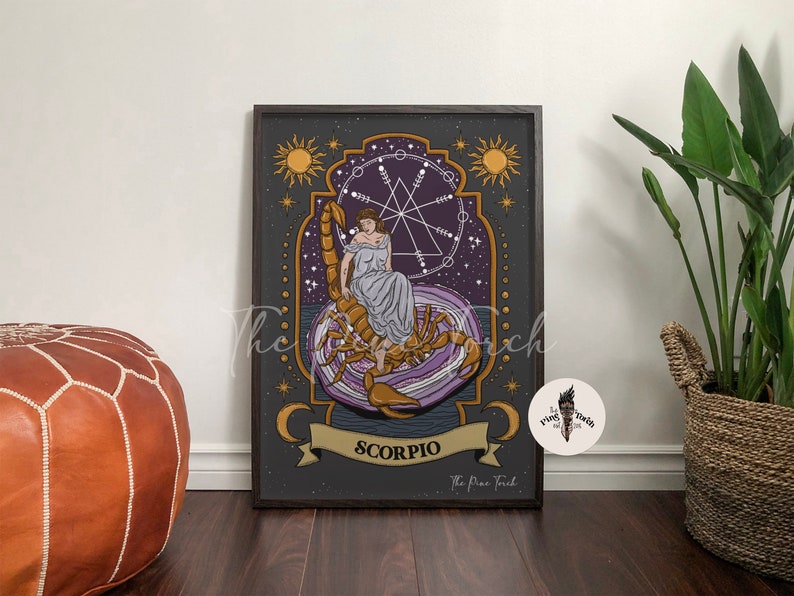 May include: A dark gray and purple illustrated print of the zodiac sign Scorpio. The image features a woman sitting on a scorpion with a starry background and a geometric design. The text "Scorpio" is written in gold lettering at the bottom of the print.
