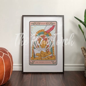 May include: A tarot card illustration with a skeletal hand holding a chicken nugget. The card is titled "The Chicken Nugget" and is framed in a black frame.