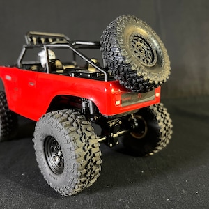 Support de roue de secours à pêne dormant SCX24