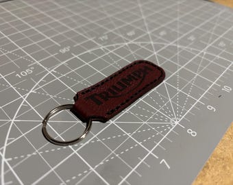Llavero plegable de cuero Triumph rojo marrón