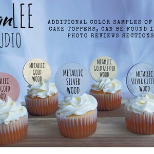 May include: Six cupcakes with different colored round cake toppers. The toppers are made of wood and have text that reads "Metallic Rose Gold Wood", "Metallic Gold Wood", "Metallic Silver Wood", "Metallic Gold Glitter Wood", "Metallic Silver Glitter Wood", and "Unpainted Wood".