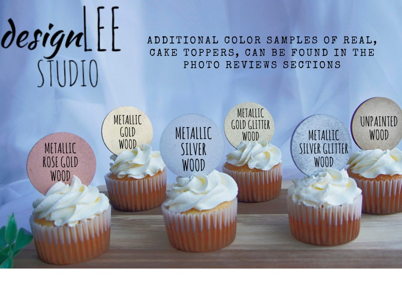 May include: Six cupcakes with different colored round cake toppers. The toppers are made of wood and have text that reads "Metallic Rose Gold Wood", "Metallic Gold Wood", "Metallic Silver Wood", "Metallic Gold Glitter Wood", "Metallic Silver Glitter Wood", and "Unpainted Wood".