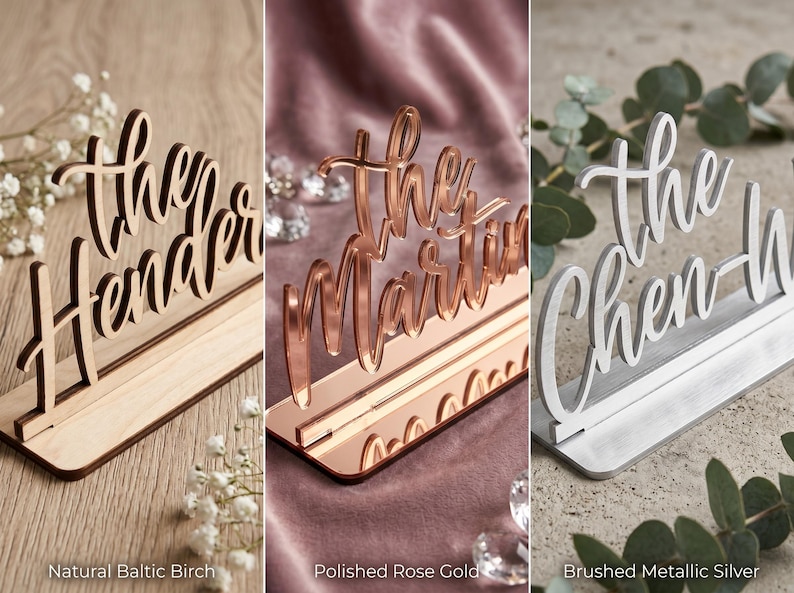 May include: Three wedding table signs in different styles. One is natural Baltic birch, another is polished rose gold, and the third is brushed metallic silver. Each sign displays a family name in elegant script.