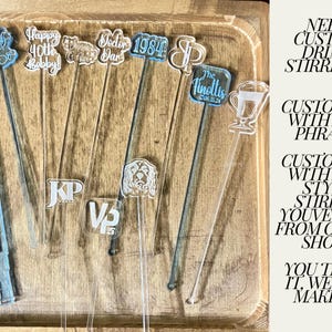 May include: A variety of custom acrylic drink stirrers with different designs and text. The stirrers are displayed on a wooden surface.  NEED CUSTOM DRINK STIRRERS? CUSTOMIZE WITH ANY PHRASE: CUSTOMIZE WITH ANY STYLE STIRRER YOU'VE SEEN FROM OTHER SHOPS YOU THINK IT. WE CAN MAKE IT