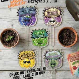 May include: A collection of whimsical garden labels with cartoon illustrations of blueberries, garlic, mint, lemon, and sage, each wearing sunglasses. The labels have text that reads "Blueberry Bash," "Garlic Glory," "Mint to Be," "Lemon Squeezy," and "Sage Sanctuary."