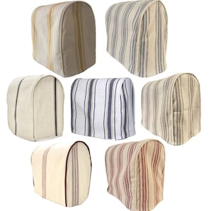 May include: Set of 8 food processor covers in various striped patterns. The covers are made of a beige fabric with different coloured stripes. The covers are designed to protect the food processor from dust and dirt.