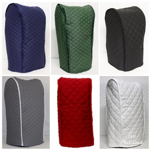 May include: Six quilted appliance covers in different colors: navy blue, green, black, gray, red, and white. Each cover has a white trim around the top edge.