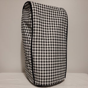 May include: Black and white gingham kitchen appliance cover with black trim.