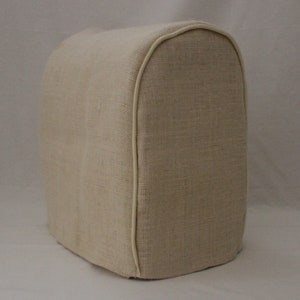 May include: A beige linen food processor cover with a white trim.