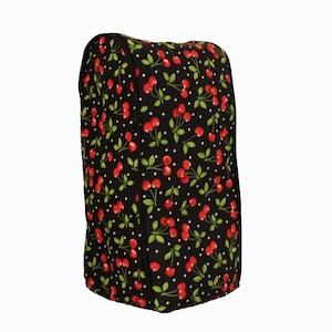 May include: Black kitchen appliance cover with a cherry and white polka dot pattern.