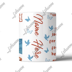 May include: White ceramic mug with a wraparound design featuring blue butterflies and birds. The mug has the words "Name Here" in red script, along with other text. A small image is visible on the side.