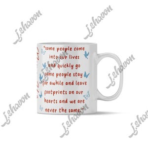 May include: White ceramic mug with a quote about people and butterflies. The quote is in red and the butterflies are blue. The mug has a white handle and is on a white background.