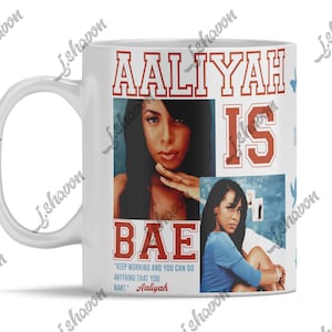 May include: White ceramic mug featuring images of Aaliyah with the words "Aaliyah Is Bae" in red and white lettering. The mug also includes a quote by Aaliyah. A handle is visible on the left side of the mug.