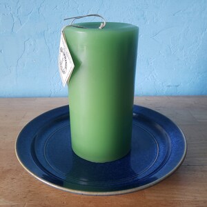 3 round, scented pillar candles 3 in x 6 in Handcrafted by a 3rd generation family owned business long burning and lightly scented Green/Bayberry