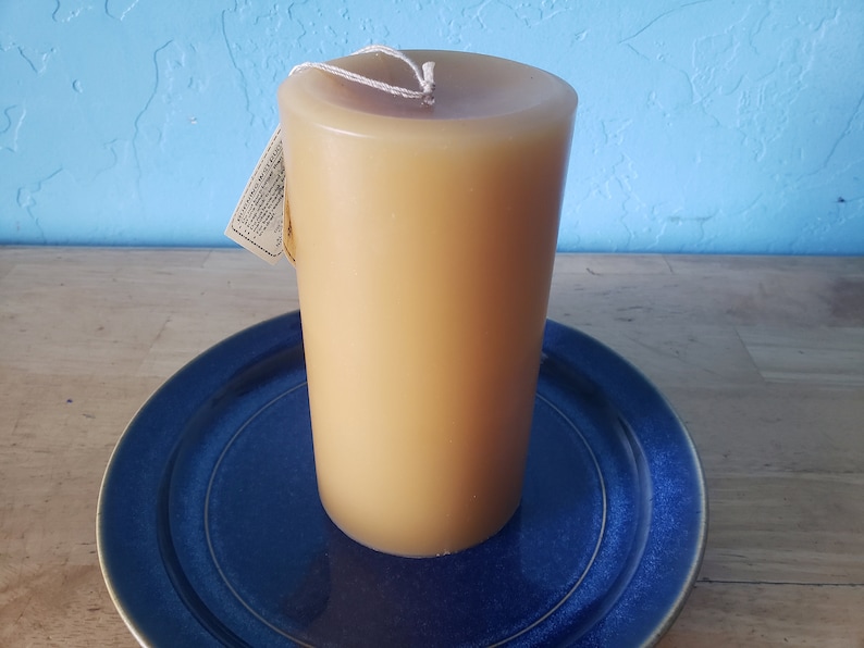 3 round, scented pillar candles 3 in x 6 in Handcrafted by a 3rd generation family owned business long burning and lightly scented Ivory/Honey Almond