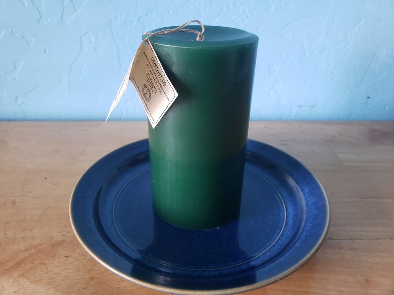 3 round, scented pillar candles 3 in x 6 in Handcrafted by a 3rd generation family owned business long burning and lightly scented ForestGreen/Wisteria