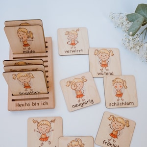 Show feelings with emotion cards according to Montessori made of wood, optional with holder