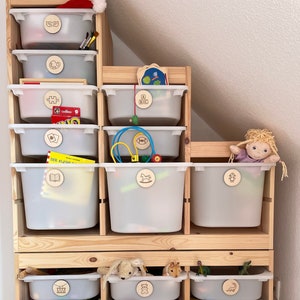 Storage tags for toys in the nursery or playroom made of wood