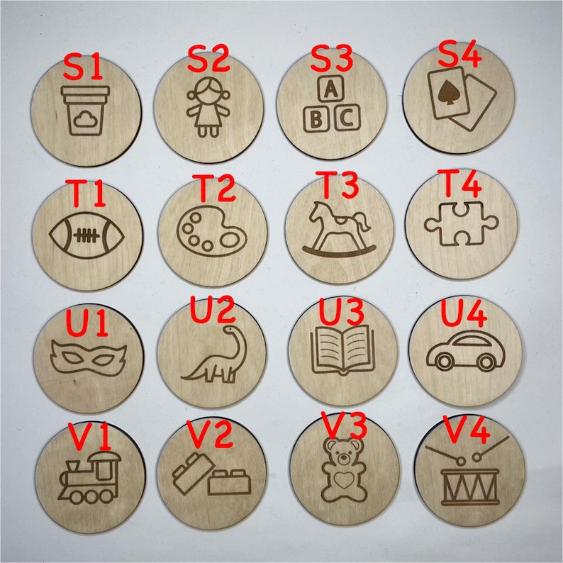 May include: A set of 16 wooden circles with various images and letters. The images include a paint palette, a rocking horse, a puzzle piece, a dinosaur, a book, a car, a train, building blocks, a teddy bear, and a drum. The letters are S1, S2, S3, S4, T1, T2, T3, T4, U1, U2, U3, U4, V1, V2, V3, and V4.