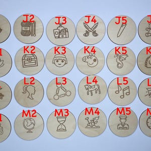 May include: Twenty-four wooden circles with different images and letters on them. The letters are J1, J2, J3, J4, J5, J6, K1, K2, K3, K4, K5, K6, L1, L2, L3, L4, L5, L6, M1, M2, M3, M4, M5, and M6.