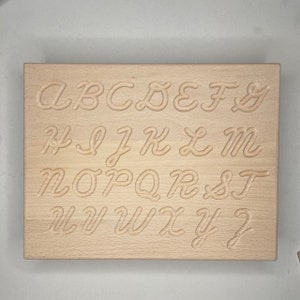 Montessori alphabet tracing board made of wood - hand writing