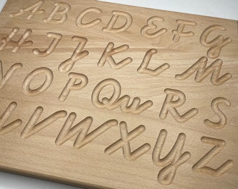 learn handwriting on Montessori alphabet board made of wood in upper and/or lower case letters