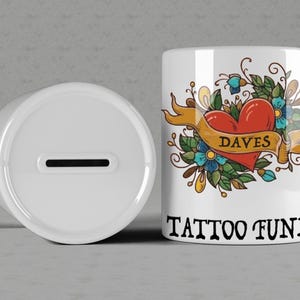 Personalised PERSONALIZED Ceramic TATTOO fund MONEY Box Savings Jar Logos Valentines Secret Santa Present Gift