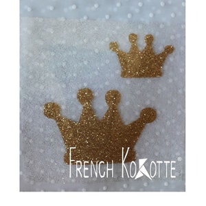 May include: Two gold glitter crowns on a white background with a white polka dot pattern. The text "French Kokotte" is visible at the bottom of the image.