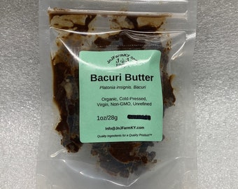 May include: A clear plastic bag containing a brown, solid, organic Bacuri Butter. The label reads "Bacuri Butter", "Platonia insignis. Bacuri", "Organic, Cold-Pressed, Virgin, Non-GMO, Unrefined", "1oz/28g", "Info@JnJFarmKY.com", and "Quality Ingredients for a Quality Product".