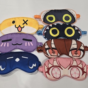 May include: A white ceramic mug with a black handle and the text "But First, Coffee" in a handwritten style. The mug is on a white surface.