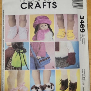 May include: A sewing pattern for a doll's outfit, including a hat, mittens, shoes, a bag, and a pouch. The pattern is from McCall's Crafts and is number 3469.