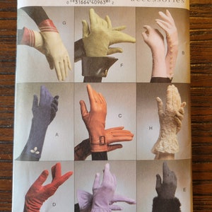 May include: A Vogue Accessories pattern featuring various glove designs. The image showcases different styles, including leather and lace gloves, in colors like red, pink, and beige. The pattern number is V8311.