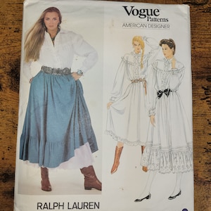 May include: Vogue Patterns American Designer sewing pattern for a dress and skirt by Ralph Lauren. The pattern number is 2881.