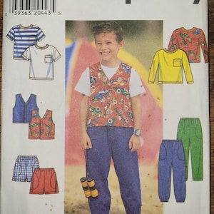 May include: Simplicity sewing pattern number 7685 for sizes BB, 5, 6, 7, and 8. The pattern includes instructions for making a vest, two t-shirts, a pair of pants, and two pairs of shorts. The pattern features a boy wearing a red vest with a car print, blue pants, and a white t-shirt.