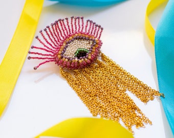 Gold fringe eye brooch / bead embroidery jewellery fancy brooches / pink looking down eye brooch pin