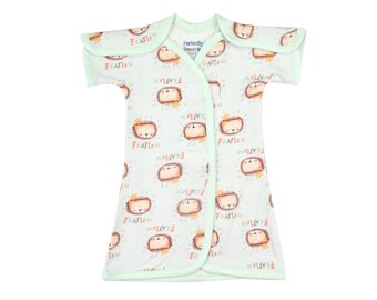 May include: A light green baby gown with short sleeves and a wrap-around design. The gown features a repeating pattern of lion faces with the text "Fearless" printed on each lion. The gown has a white collar with the text "Perfectly Precious" printed on it.