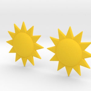 May include: Two yellow sun-shaped earrings with a 12-point star design.