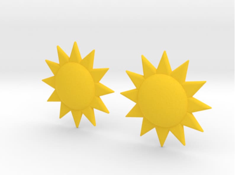 May include: Two yellow sun-shaped earrings with a 12-point star design.