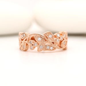 Vine and leaf diamond band in rose gold with millgrain detailing.