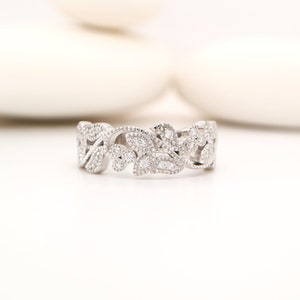 Vine and leaf diamond band in white gold with millgrain detailing.
