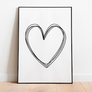 Puede incluir: Un dibujo en blanco y negro de un corazón en un marco negro sobre una pared blanca.